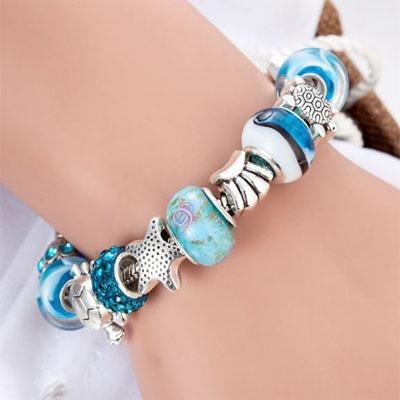 Charming turquoise and silver colour bracelet with sea themed charms Jewellery & Watches Iconix 