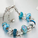 Charming turquoise and silver colour bracelet with sea themed charms Jewellery & Watches Iconix 