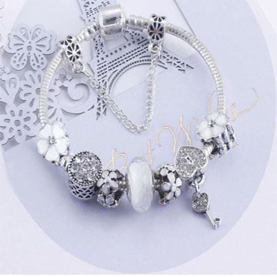 Charming White and Silver colour bracelet with Heart Locket and Flower themed charms Jewellery & Watches Iconix 